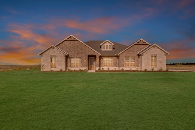 craftsman-style house with a yard