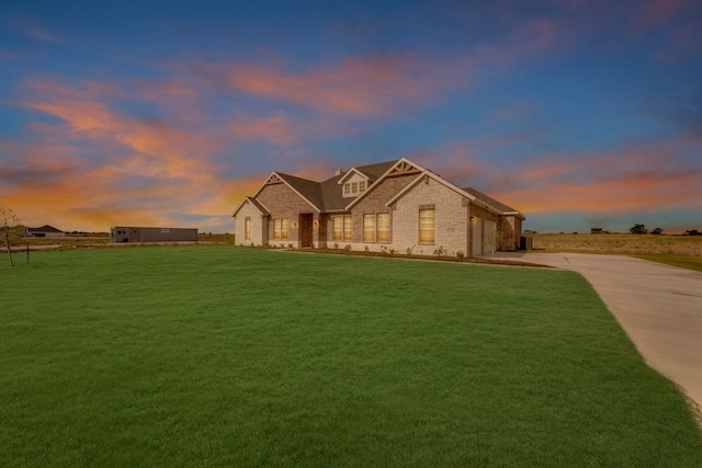 view of front of property with a yard