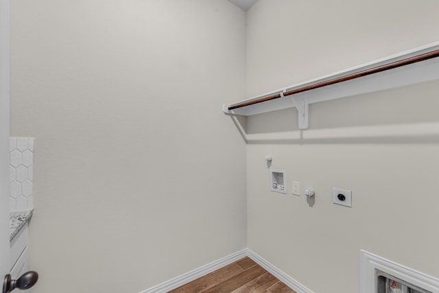 laundry area featuring hookup for a washing machine, hookup for a gas dryer, hardwood / wood-style floors, and electric dryer hookup