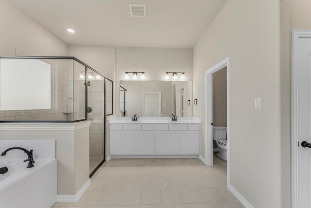 full bathroom with vanity, shower with separate bathtub, toilet, and tile patterned floors