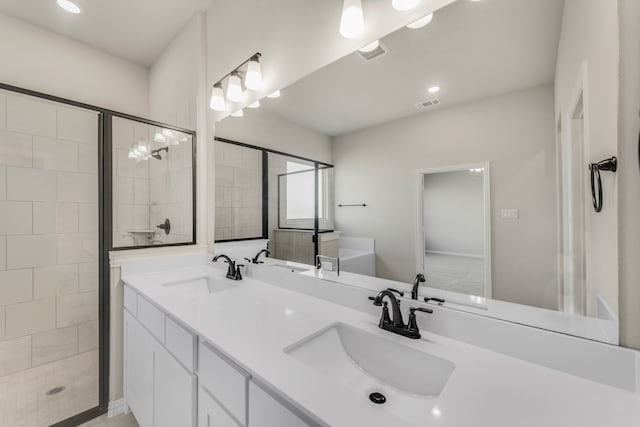 bathroom featuring walk in shower and vanity