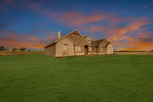 craftsman-style home featuring a lawn