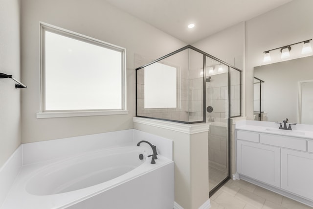 bathroom featuring vanity and plus walk in shower