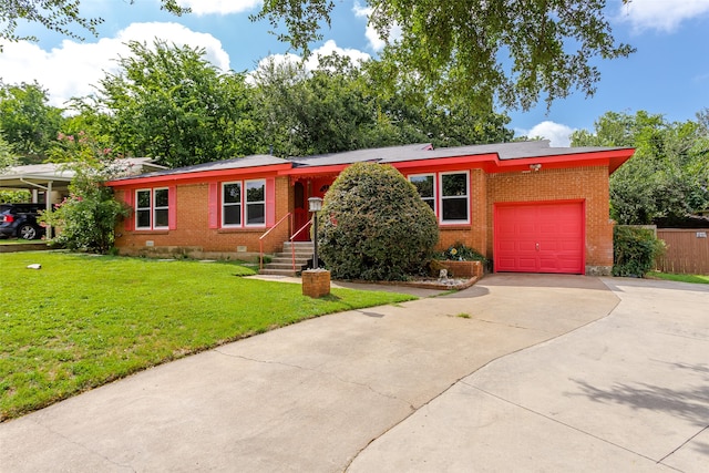 view of front facade with a garage and a front lawn