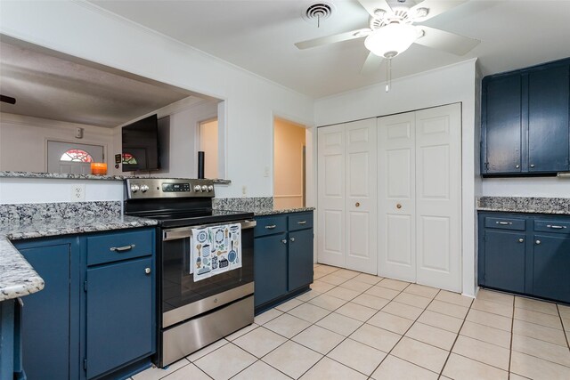 kitchen featuring ceiling fan, light tile patterned floors, stainless steel electric stove, blue cabinets, and ornamental molding