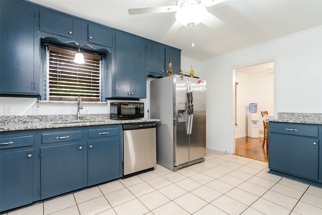 kitchen featuring appliances with stainless steel finishes, sink, light wood-type flooring, ceiling fan, and blue cabinetry