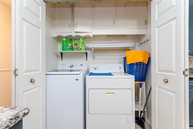 clothes washing area featuring washing machine and clothes dryer