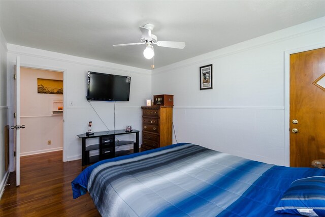 bedroom with ornamental molding, ceiling fan, and hardwood / wood-style floors