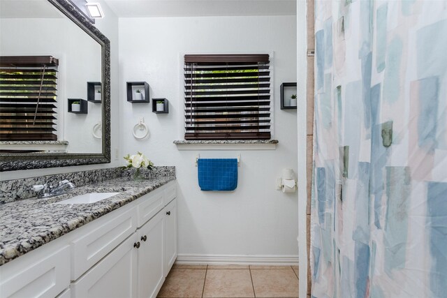 bathroom featuring tile patterned floors and vanity