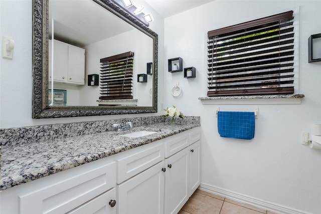 bathroom with tile patterned floors and vanity