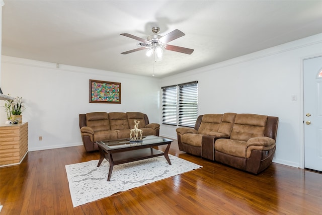 living room featuring ornamental molding, dark hardwood / wood-style flooring, and ceiling fan