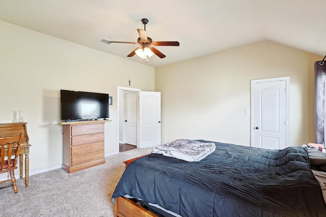 carpeted bedroom with vaulted ceiling and ceiling fan