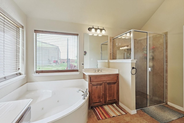 bathroom featuring vanity, tile patterned floors, and shower with separate bathtub