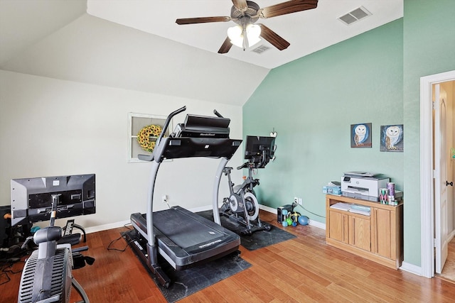 exercise room with lofted ceiling, hardwood / wood-style floors, and ceiling fan