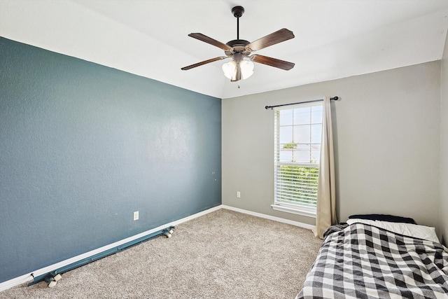 unfurnished bedroom featuring light carpet and ceiling fan