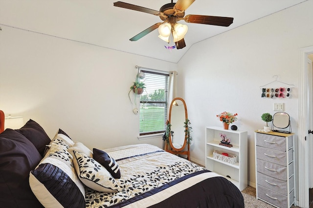 carpeted bedroom with vaulted ceiling and ceiling fan