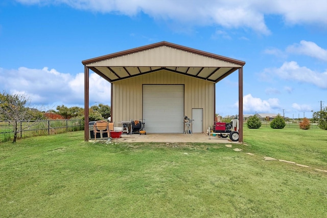 view of outbuilding featuring a garage and a yard