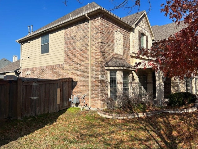 view of property exterior featuring a yard