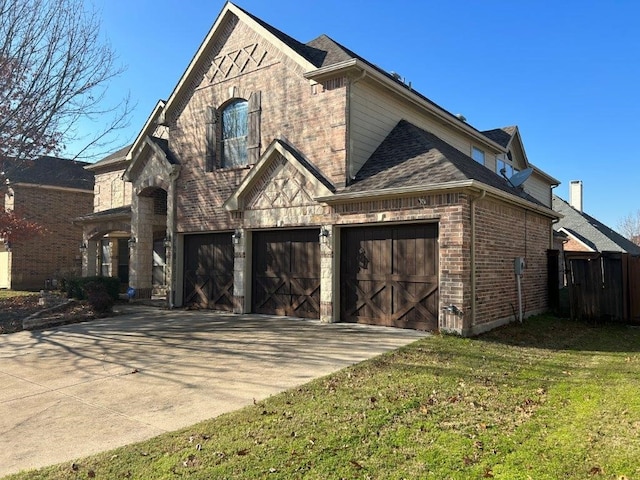 view of front of house featuring a garage and a front yard