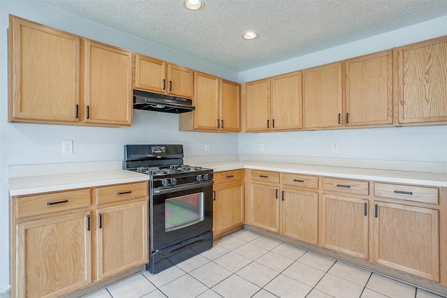 kitchen with black gas range, light brown cabinetry, and light tile patterned floors