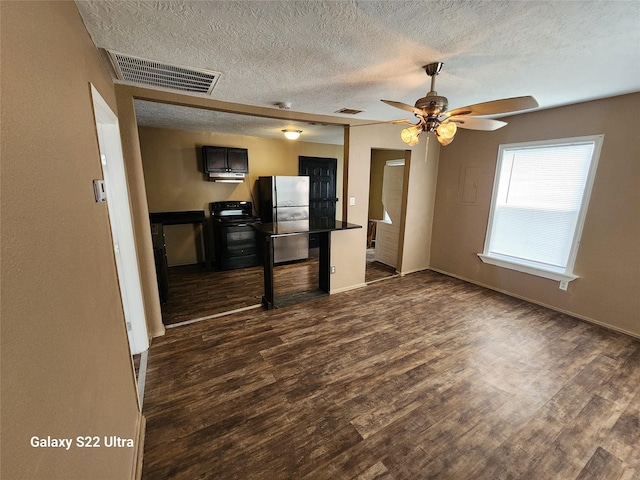 interior space with dark hardwood / wood-style floors and ceiling fan