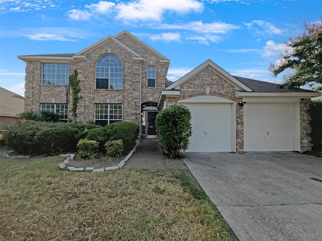 view of front of house featuring a garage and a front yard