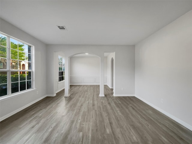 unfurnished living room featuring hardwood / wood-style flooring