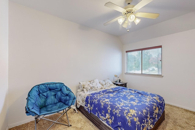 carpeted bedroom with vaulted ceiling and ceiling fan