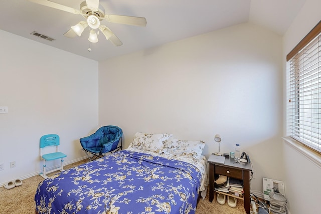 bedroom featuring lofted ceiling, ceiling fan, and carpet