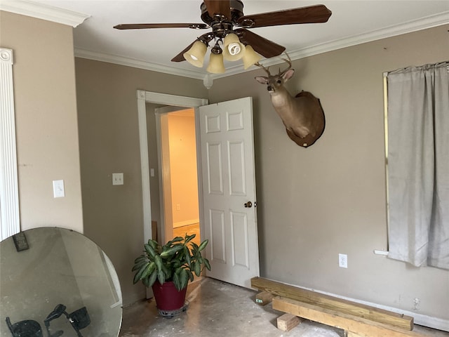 interior space featuring ceiling fan, ornamental molding, and concrete floors