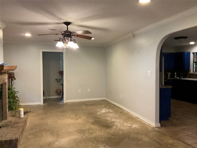 living room with a fireplace, ornamental molding, and ceiling fan