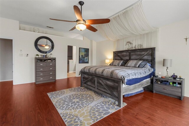 bedroom featuring wood-type flooring, ceiling fan, and vaulted ceiling