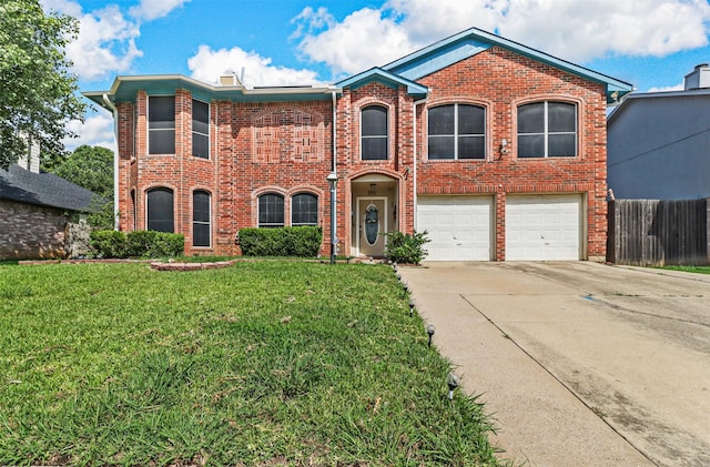 view of front of property featuring a garage and a front lawn