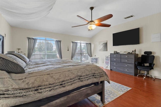 bedroom featuring vaulted ceiling, ceiling fan, and hardwood / wood-style floors