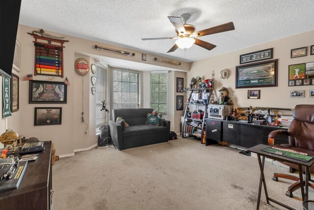 interior space featuring ceiling fan and a textured ceiling