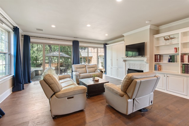 living room with crown molding and dark hardwood / wood-style floors