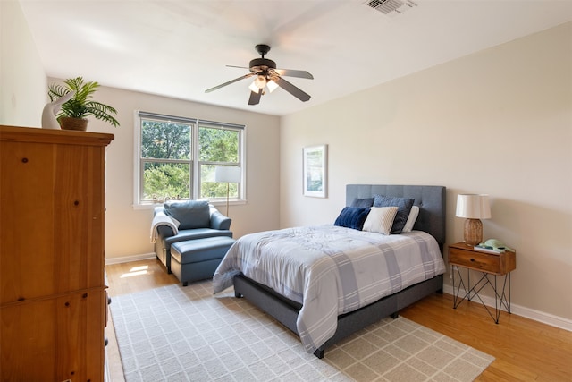 bedroom with ceiling fan and light wood-type flooring