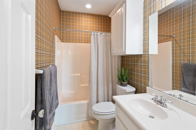 full bathroom with vanity, toilet, and shower / bath combination with curtain