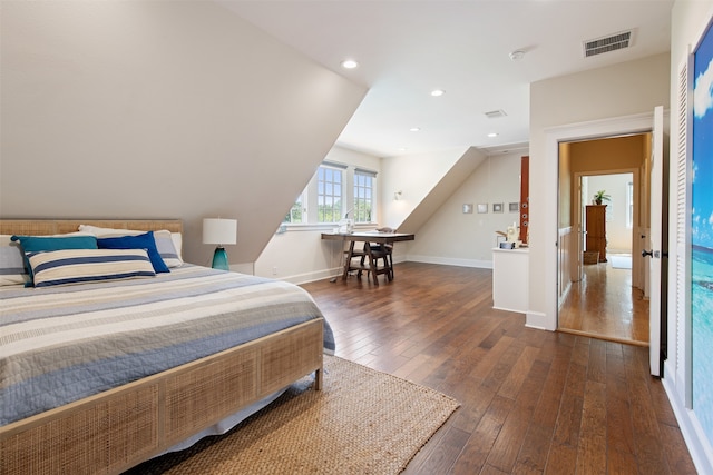 bedroom with dark hardwood / wood-style flooring