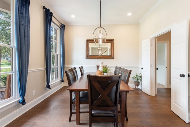 dining room with dark wood-type flooring and ornamental molding