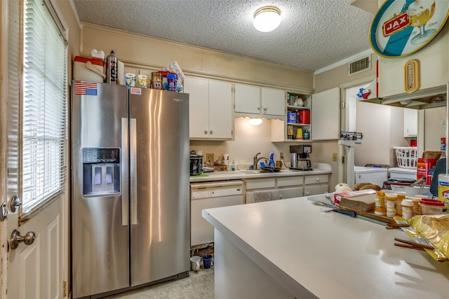 kitchen featuring sink, white dishwasher, white cabinetry, stainless steel fridge with ice dispenser, and a textured ceiling