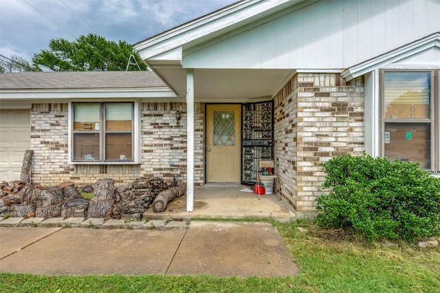 property entrance with brick siding