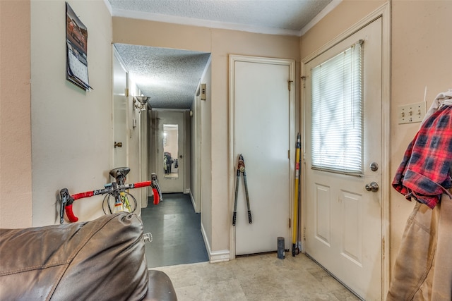 doorway featuring a textured ceiling