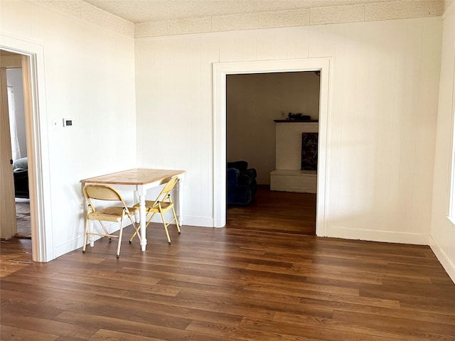 dining space featuring dark wood-type flooring