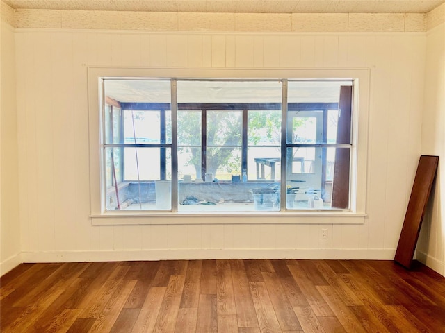 empty room with dark hardwood / wood-style floors