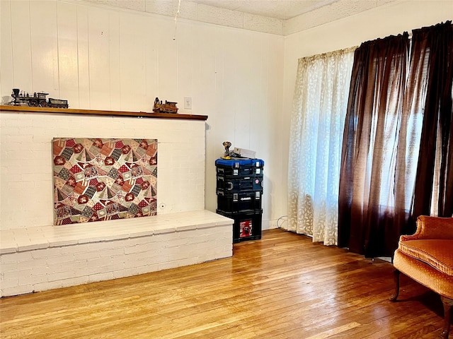 sitting room with hardwood / wood-style floors