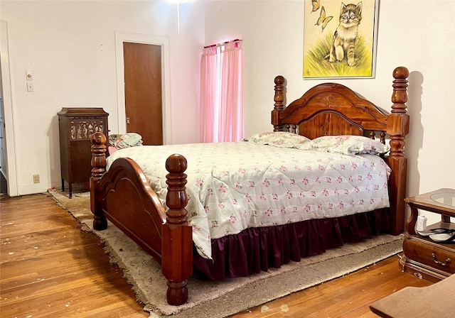 bedroom featuring wood-type flooring