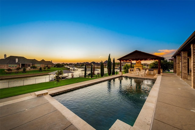 view of pool with a fenced in pool, a patio, a lawn, a gazebo, and fence