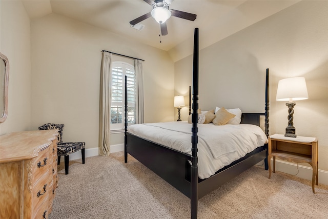 carpeted bedroom with ceiling fan and lofted ceiling