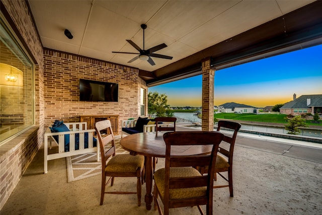 view of patio featuring ceiling fan